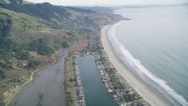 5K aerial stock footage of flying over marshlands near Lagoon, tilt to reveal beachfront homes, Bolinas, California Aerial Stock Footage | DFKSF06_147