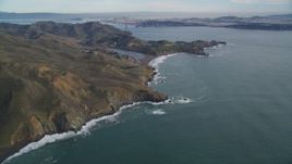 5K aerial stock footage of flying by Marin Headlands, San Francisco in the distance, Marin County, California Aerial Stock Footage | DFKSF06_153
