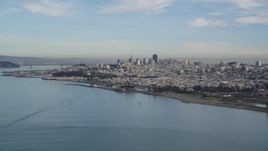 5K aerial stock footage flying low over the bay and ascending toward Downtown San Francisco skyline, California Aerial Stock Footage | DFKSF06_164