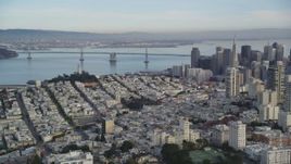 5K aerial stock footage approach Coit Tower, Bay Bridge, pan skyscrapers in Downtown San Francisco, California Aerial Stock Footage | DFKSF06_168