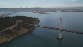 5K aerial stock footage approach the Bay Bridge and tilt to Yerba Buena Island, San Francisco, California Aerial Stock Footage | DFKSF06_182