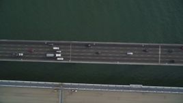 5K aerial stock footage of a bird's eye view of traffic crossing the upper deck of Bay Bridge, San Francisco, California Aerial Stock Footage | DFKSF06_185