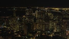 5K aerial stock footage tilt from apartment and office buildings to reveal skyscrapers in Downtown San Francisco, California, night Aerial Stock Footage | DFKSF07_008