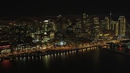 5K aerial stock footage of approaching skyscrapers from the bay, Downtown San Francisco, California, night Aerial Stock Footage | DFKSF07_012