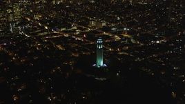 5K aerial stock footage orbit Coit Tower, to reveal skyscrapers in Downtown San Francisco, California, night Aerial Stock Footage | DFKSF07_021