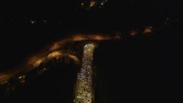 5K aerial stock footage of heavy traffic exiting the Yerba Buena Tunnel, Bay Bridge, San Francisco, California, night Aerial Stock Footage | DFKSF07_027