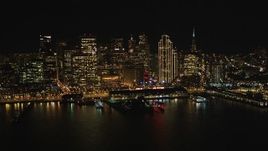 5K aerial stock footage fly away from the Ferry Building and skyscrapers in Downtown San Francisco, California, night Aerial Stock Footage | DFKSF07_075