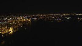 5K aerial stock footage of panning across and approaching the Port of Oakland in California, night Aerial Stock Footage | DFKSF07_077