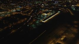 5K aerial stock footage fly over I-880, tilt revealing Downtown Oakland, California, night Aerial Stock Footage | DFKSF07_079