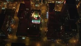 5K aerial stock footage approach Tribune Tower office building and tilt to bird's eye view, Downtown Oakland, California, night Aerial Stock Footage | DFKSF07_082