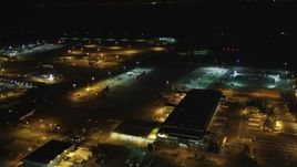 5K aerial stock footage fly by FedEx terminal, Oakland International Airport, Oakland, California, night Aerial Stock Footage | DFKSF07_091