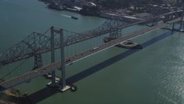 5K aerial stock footage of tilting from a docked ship at California Maritime Academy to reveal Carquinez Bridge, California Aerial Stock Footage | DFKSF08_034