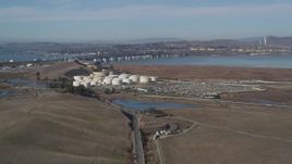 5K aerial stock footage of flying by oil refinery, Benicia-Martinez Bridge, Copart Auction, Martinez, California Aerial Stock Footage | DFKSF08_065