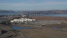 5K aerial stock footage of passing by oil refinery, Beinicia-Martinez Bridge, Copart Auction, Martinez, California Aerial Stock Footage | DFKSF08_066
