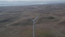 5K aerial stock footage of fly away from windmill at Shiloh Wind Power Plant, Montezuma Hills, California Aerial Stock Footage | DFKSF08_076