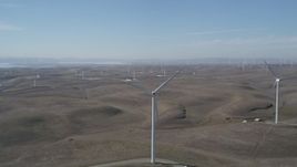 5K aerial stock footage flyby a row of windmills, Shiloh Wind Power Plant, Montezuma Hills, California Aerial Stock Footage | DFKSF08_077