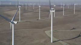 5K aerial stock footage of flying by windmills at Shiloh Wind Power Plant, Montezuma Hills, California Aerial Stock Footage | DFKSF08_081