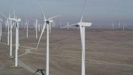 5K aerial stock footage of flying by windmills at Shiloh Wind Power Plant, Montezuma Hills, California Aerial Stock Footage | DFKSF08_093