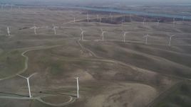 5K aerial stock footage of flying by field of windmills, Shiloh Wind Power Plant, Montezuma Hills, California Aerial Stock Footage | DFKSF08_096