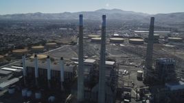 5K aerial stock footage of orbiting a power plant's smoke stacks, Pittsburg, California Aerial Stock Footage | DFKSF08_100