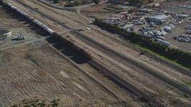 5K aerial stock footage of passing in front of a moving train, Pittsburg, California Aerial Stock Footage | DFKSF08_104