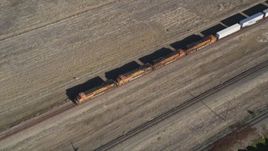 5K aerial stock footage of tracking a train passing through Pittsburg, California Aerial Stock Footage | DFKSF08_105