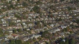 5K aerial stock footage of a reverse view of tract homes in residential neighborhoods, Martinez, California Aerial Stock Footage | DFKSF09_004