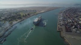 5K aerial stock footage of tracking a cargo ship by the Port of Oakland, California Aerial Stock Footage | DFKSF09_018