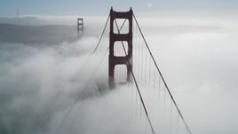 5K aerial stock footage flyby the Golden Gate Bridge shrouded in fog, San Francisco, California Aerial Stock Footage | DFKSF09_025