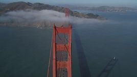 5K aerial stock footage of flying by one of the Golden Gate Bridge towers and light fog, San Francisco, California Aerial Stock Footage | DFKSF09_031