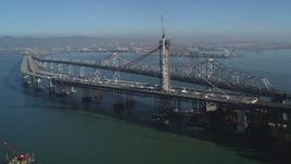 5K aerial stock footage of flying by the new spans under construction, Bay Bridge, San Francisco, California Aerial Stock Footage | DFKSF09_053