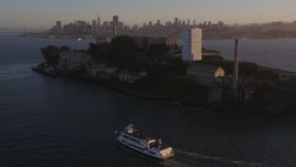 5K aerial stock footage of flying by Alcatraz prison in San Francisco, California, sunset Aerial Stock Footage | DFKSF10_018