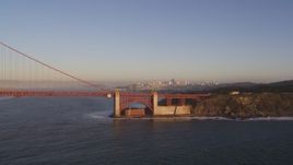 5K aerial stock footage of flying by Golden Gate Bridge with view of Downtown San Francisco, California, sunset Aerial Stock Footage | DFKSF10_025