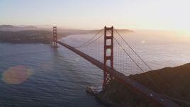 5K aerial stock footage of a reverse view of the Golden Gate Bridge and setting sun in San Francisco, California Aerial Stock Footage | DFKSF10_030