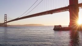 5K aerial stock footage of flying low and panning across Golden Gate Bridge, San Francisco, California, sunset Aerial Stock Footage | DFKSF10_031