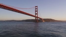 5K aerial stock footage of flying low altitude by Golden Gate Bridge, reveal Downtown San Francisco, California, sunset Aerial Stock Footage | DFKSF10_033