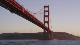 5K aerial stock footage of flying low under the famous Golden Gate Bridge in San Francisco, California, sunset Aerial Stock Footage | DFKSF10_038
