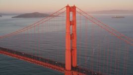 5K aerial stock footage of flying by one tower of the Golden Gate Bridge, San Francisco, California, sunset Aerial Stock Footage | DFKSF10_041
