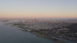 5K aerial stock footage of approaching the Downtown San Francisco skyline at sunset, California Aerial Stock Footage | DFKSF10_043