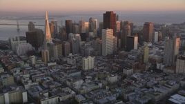 5K aerial stock footage tilt from apartment buildings to reveal Downtown San Francisco skyscrapers, California, sunset Aerial Stock Footage | DFKSF10_046