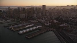 5K aerial stock footage pan from Coit Tower, revealing Downtown San Francisco skyscrapers, California, sunset Aerial Stock Footage | DFKSF10_063