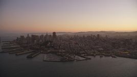 5K aerial stock footage of flying away from Downtown San Francisco piers and skyscrapers, California, twilight Aerial Stock Footage | DFKSF10_065