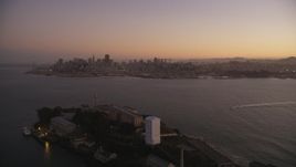 5K aerial stock footage of flying away from downtown, revealing Alcatraz, Downtown San Francisco, California, twilight Aerial Stock Footage | DFKSF10_066