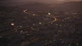 5K aerial stock footage approach Interstate 80 freeway and police department in South of Market, San Francisco, California, twilight Aerial Stock Footage | DFKSF10_077