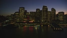 5K aerial stock footage of the Ferry Building and towering skyscrapers in Downtown San Francisco, California, night Aerial Stock Footage | DFKSF10_092