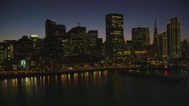5K aerial stock footage of approaching skyscrapers while flying over the bay, Downtown San Francisco, California, night Aerial Stock Footage | DFKSF10_096