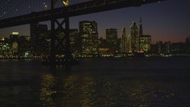 5K aerial stock footage of approaching the Bay Bridge and the skyline of Downtown San Francisco, California, night Aerial Stock Footage | DFKSF10_099