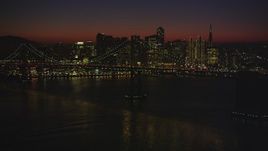5K aerial stock footage of the Bay Bridge with Downtown San Francisco skyline in the background, California, night Aerial Stock Footage | DFKSF10_106