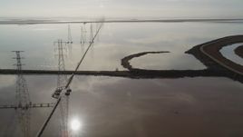 5K aerial stock footage of flying by power lines and marshlands, Sunnyvale, California Aerial Stock Footage | DFKSF11_008