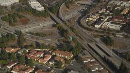 5K aerial stock footage of a reverse view of the I-280 freeway interchange and tract homes, San Jose, California Aerial Stock Footage | DFKSF12_009